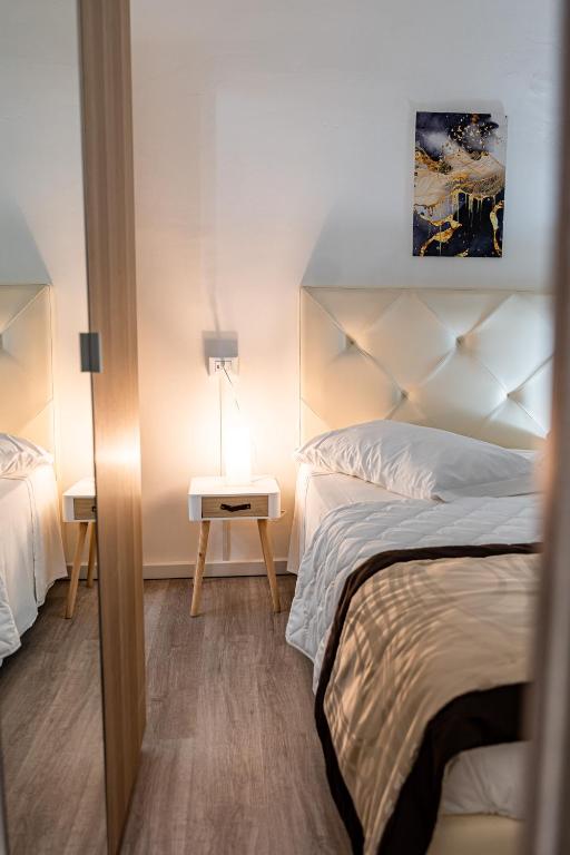 Posteľ alebo postele v izbe v ubytovaní Florence Rooms Novella