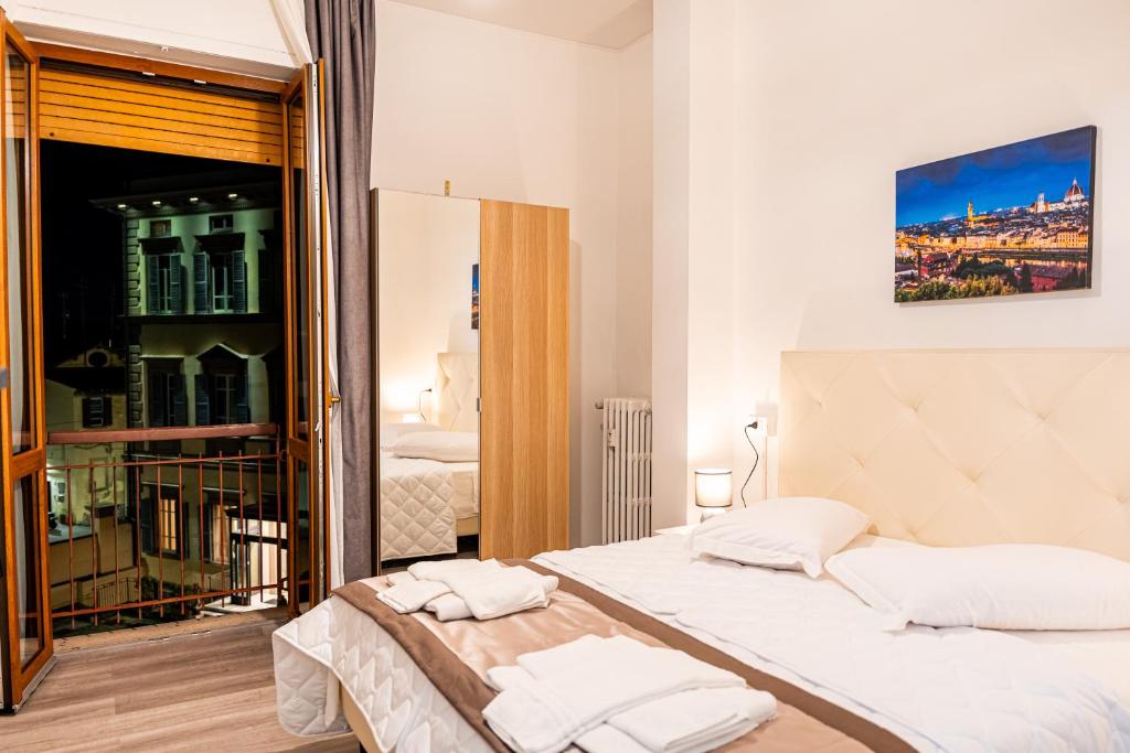 Posteľ alebo postele v izbe v ubytovaní Florence Rooms Novella