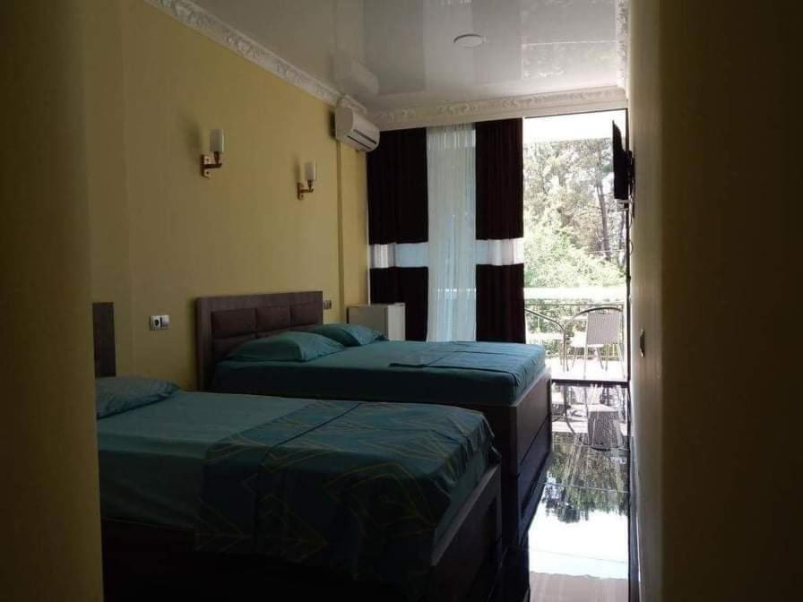 Postel nebo postele na pokoji v ubytování Guesthouse Agmashenebeli Sea side