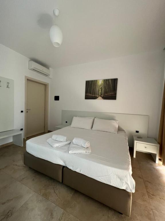 Postel nebo postele na pokoji v ubytování Hotel Brilant