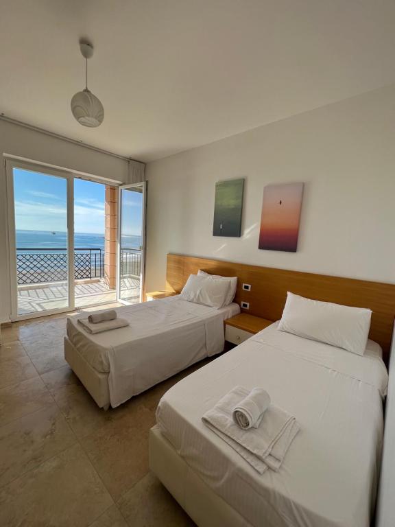 Postel nebo postele na pokoji v ubytování Hotel Brilant