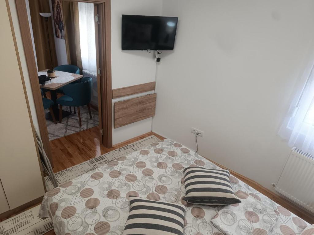 Postel nebo postele na pokoji v ubytování Apartman Dunja i Petar