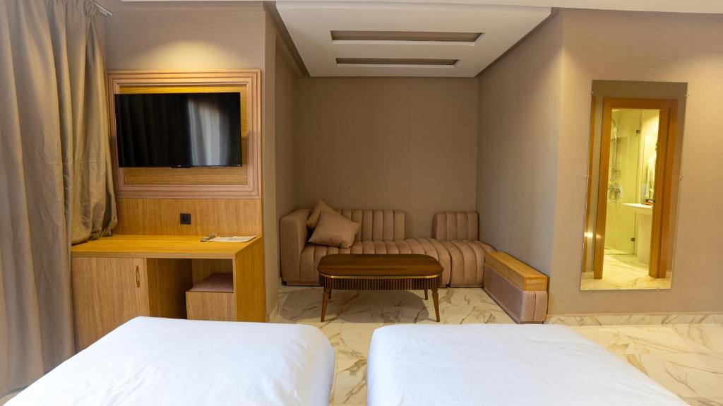 Postel nebo postele na pokoji v ubytování Hôtel Atlas Day