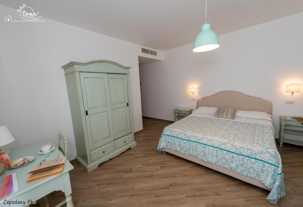 Postel nebo postele na pokoji v ubytování B&B Toma'