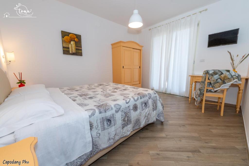 Postel nebo postele na pokoji v ubytování B&B Toma'