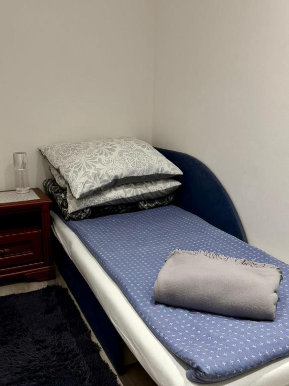 Postel nebo postele na pokoji v ubytování Leśny Zakątek