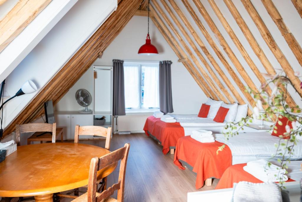 Postel nebo postele na pokoji v ubytování Hotel - Cafe De Harmonie