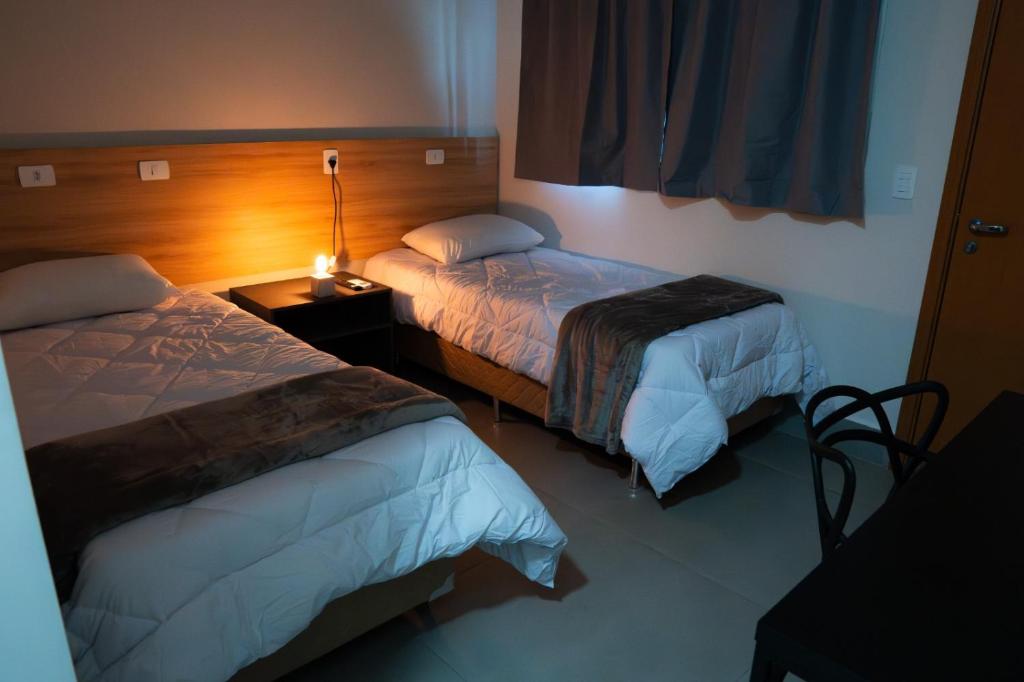 Postel nebo postele na pokoji v ubytování Dicopi Hotel