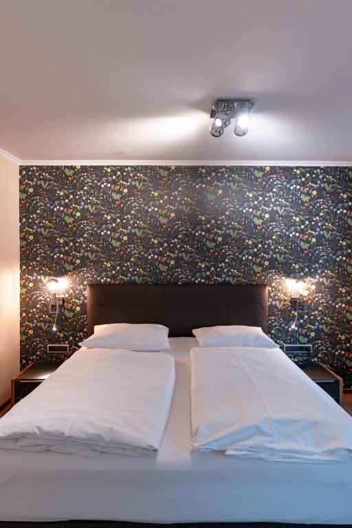 Postel nebo postele na pokoji v ubytování Boutique-Hotel Bayerischer Hof