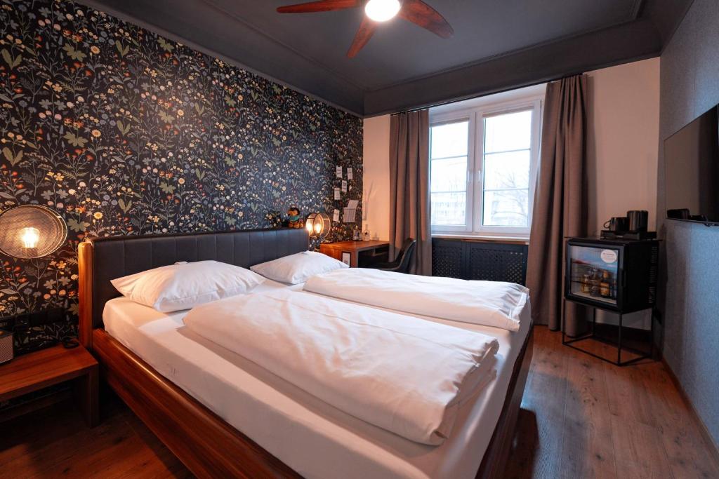 Postel nebo postele na pokoji v ubytování Boutique-Hotel Bayerischer Hof