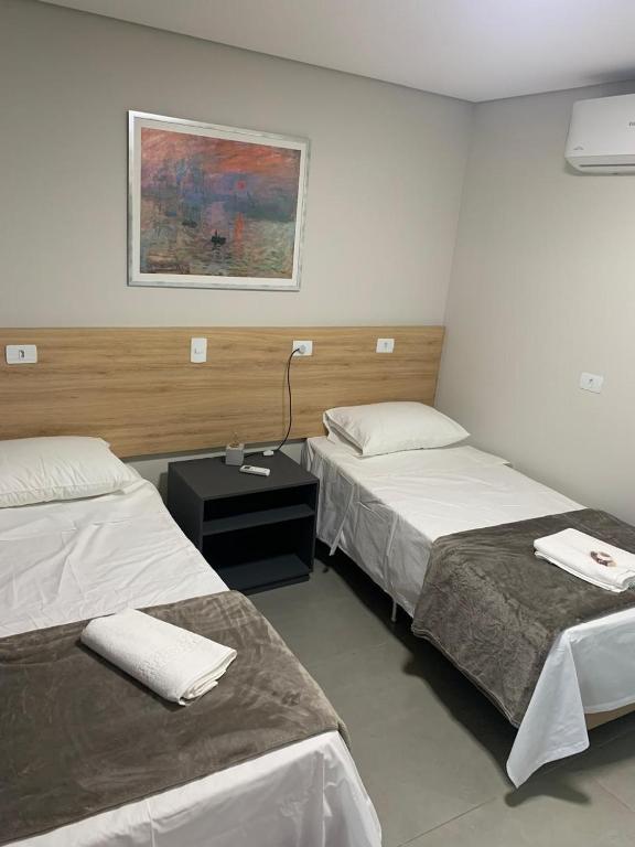 Postel nebo postele na pokoji v ubytování Dicopi Hotel