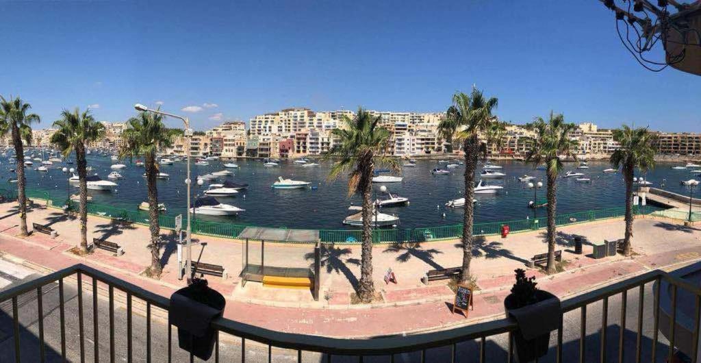 a view of a marina with boats in the water at Apartment Marsascala Seafront in Il-Kappara