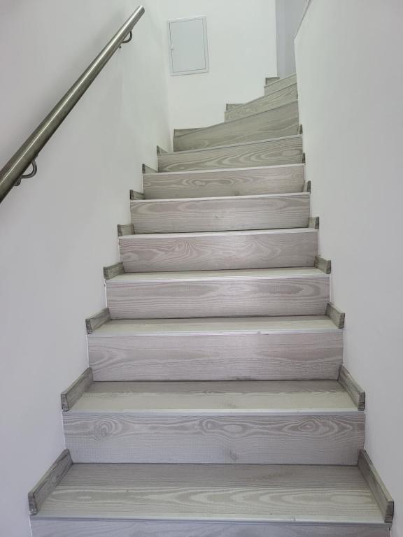 a set of stairs in a house at Penthouse Marasti in Cluj-Napoca
