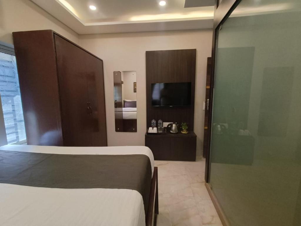 Postel nebo postele na pokoji v ubytování Hotel Rose Inn