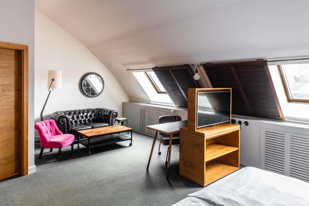 TV a/nebo společenská místnost v ubytování pentahotel Leuven