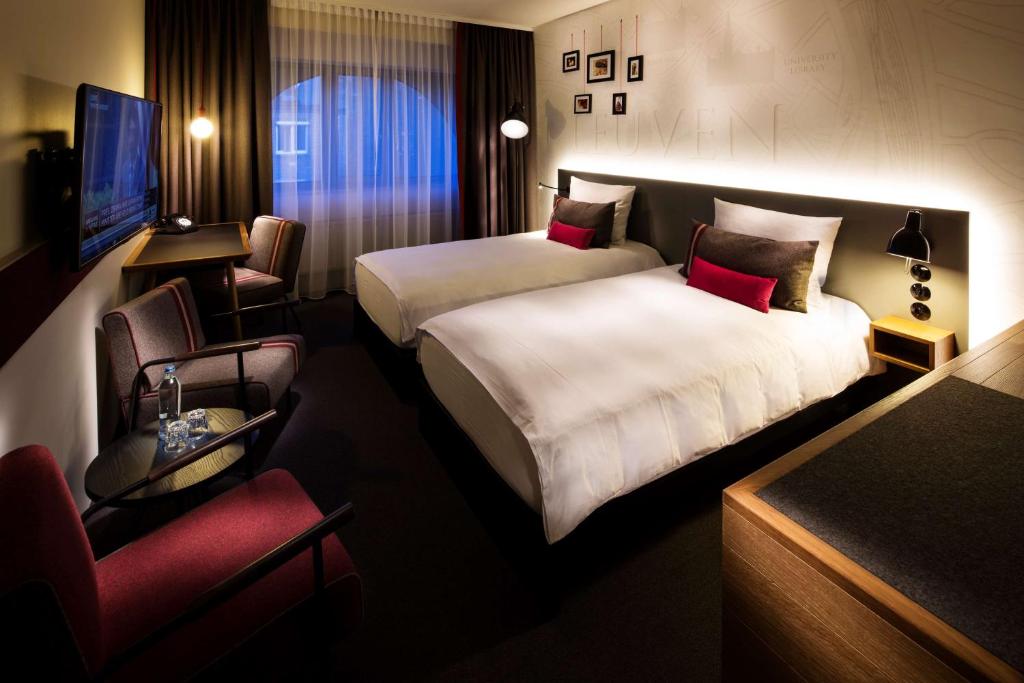 Postel nebo postele na pokoji v ubytování pentahotel Leuven