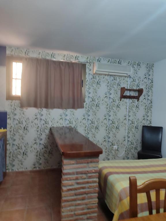Fotografie z fotogalerie ubytování Pensión y apartamentos El Taxi v destinaci Casabermeja