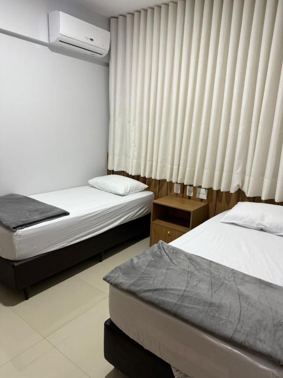 Postel nebo postele na pokoji v ubytování Apartamento novinho em Belém