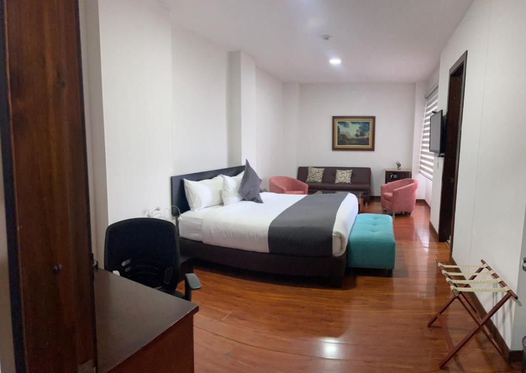 Postel nebo postele na pokoji v ubytování Hotel macao colombia