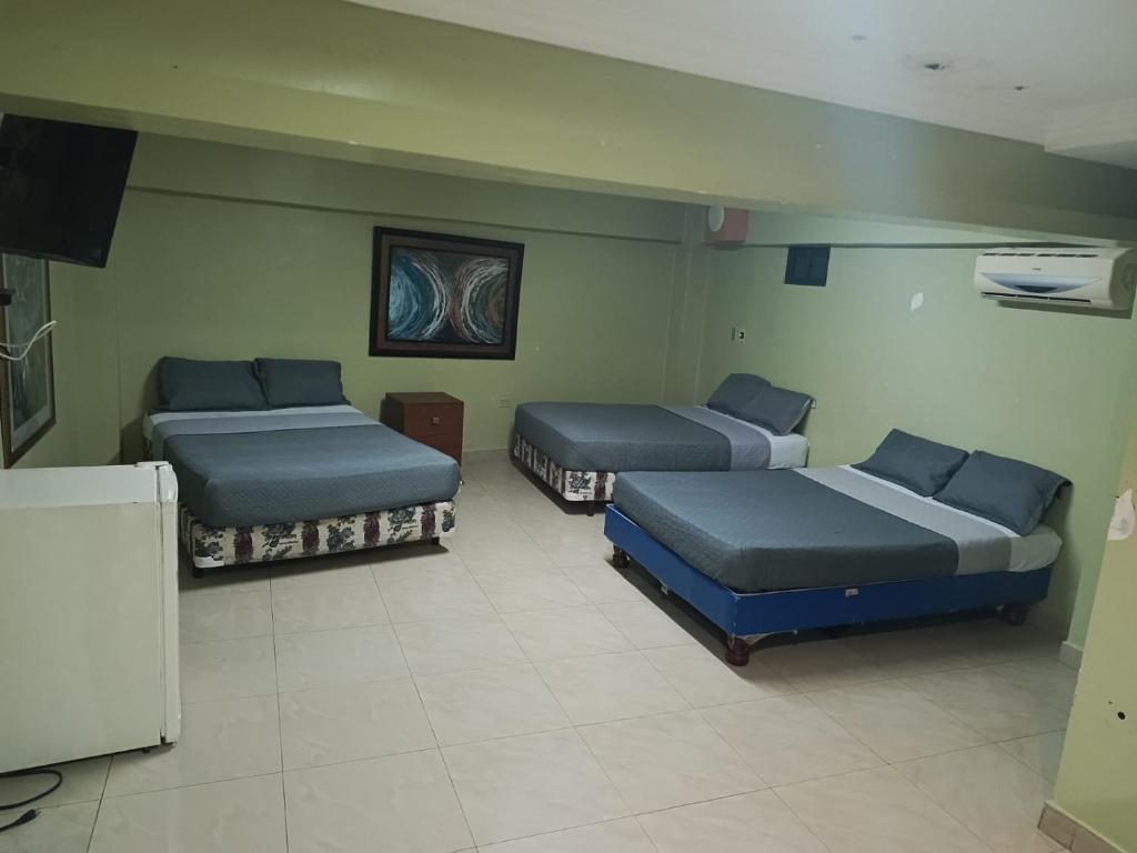 TV a/nebo společenská místnost v ubytování Hotel Caribe