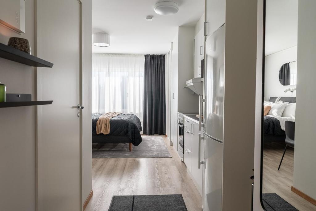 Postel nebo postele na pokoji v ubytování Guestly Homes - Modern Studio Apt