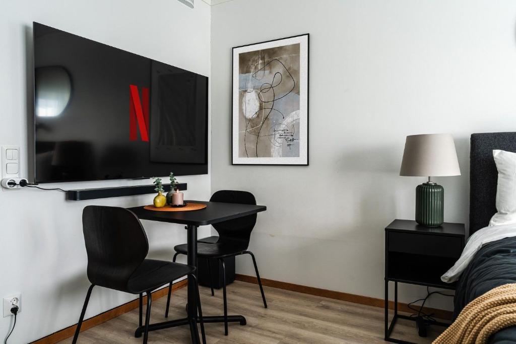 Postel nebo postele na pokoji v ubytování Guestly Homes - Modern Studio Apt