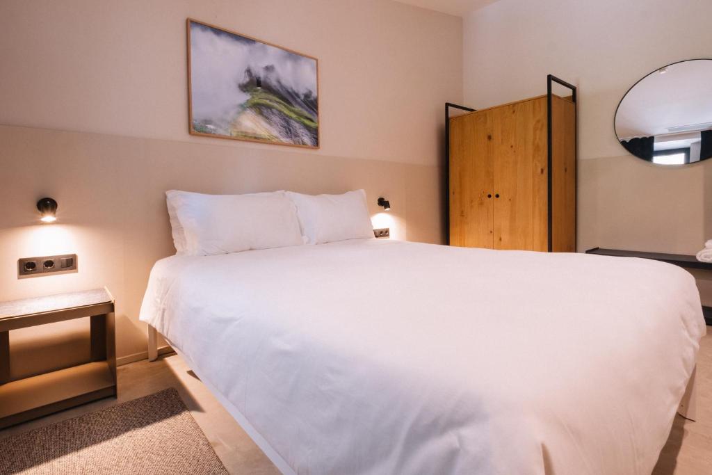 Postel nebo postele na pokoji v ubytování Gandum Village - Conscious Boutique Hotel