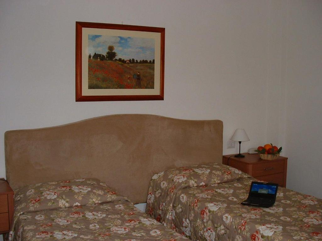 Postel nebo postele na pokoji v ubytování Hotel Barberino