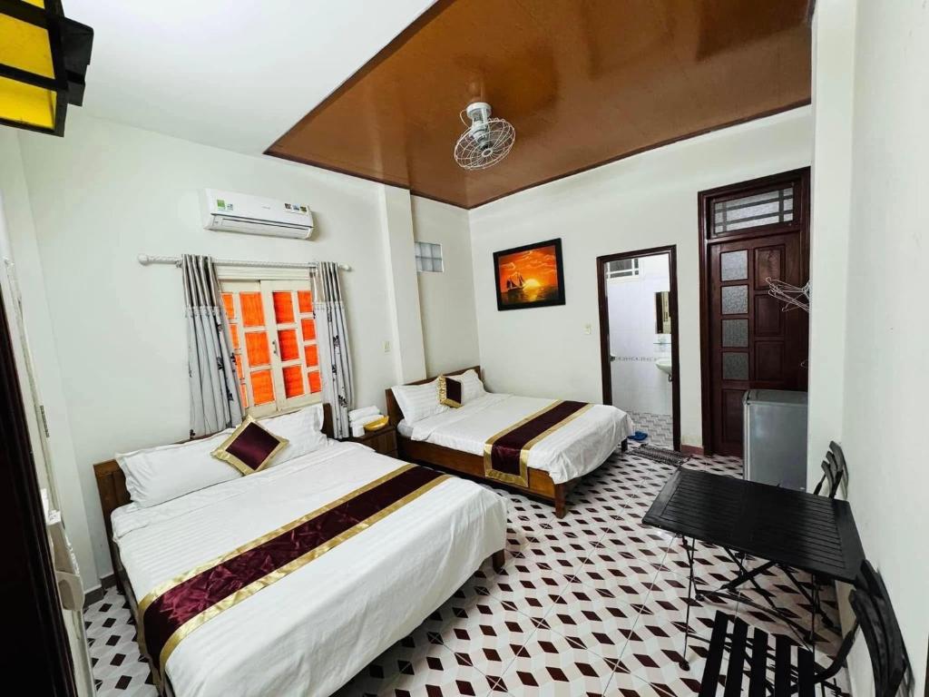 Postel nebo postele na pokoji v ubytování DK House Homestay