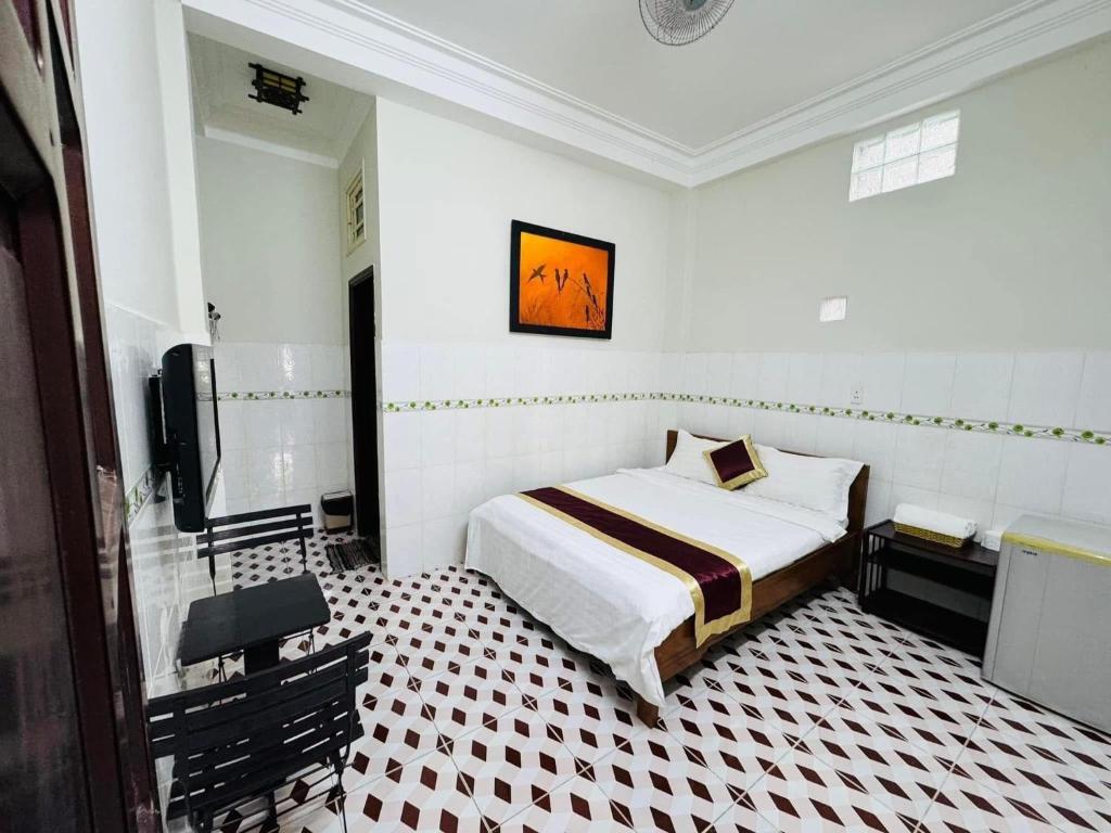Postel nebo postele na pokoji v ubytování DK House Homestay