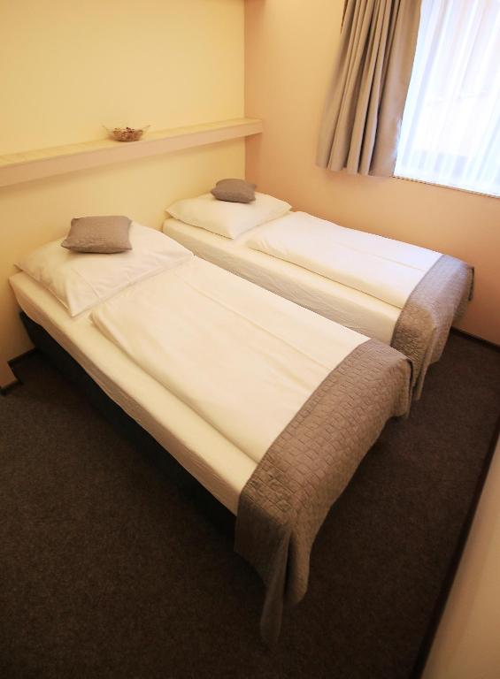 Postel nebo postele na pokoji v ubytování U Admirala
