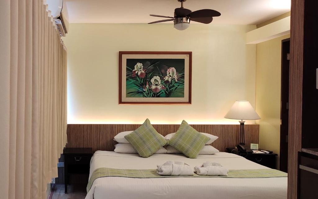 Postel nebo postele na pokoji v ubytování Hotel Fleuris