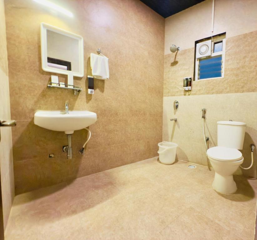 Koupelna v ubytování Hotel New Blue Rocks Sarjapur