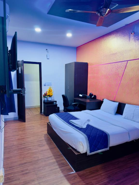 Postel nebo postele na pokoji v ubytování Hotel New Blue Rocks Sarjapur