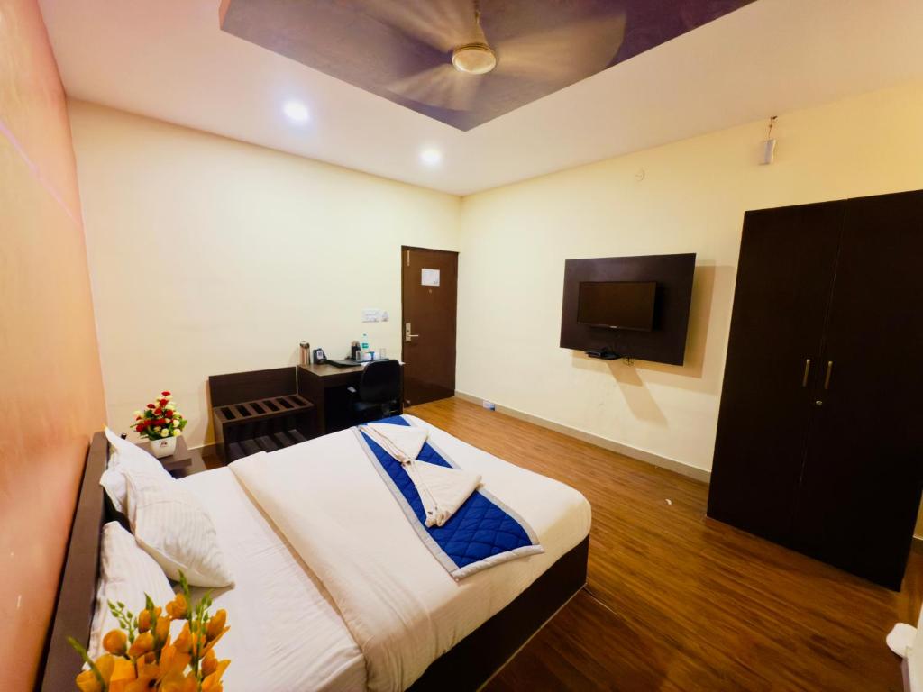 Postel nebo postele na pokoji v ubytování Hotel New Blue Rocks Sarjapur