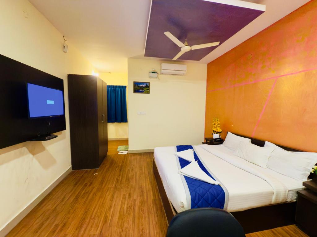 Postel nebo postele na pokoji v ubytování Hotel New Blue Rocks Sarjapur