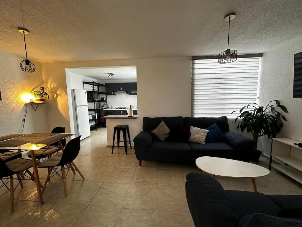 a living room with a couch and a table at Casa de Lucas in Balvanera