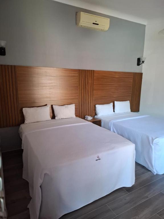 Postel nebo postele na pokoji v ubytování Hotel Aquiles