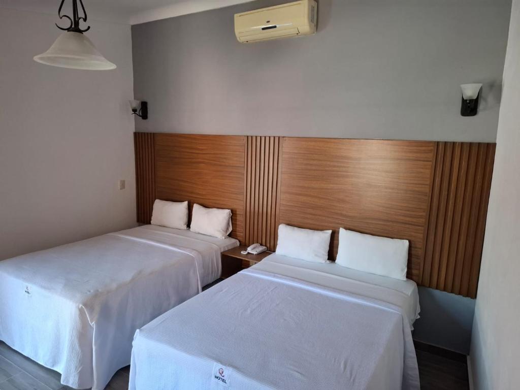 Postel nebo postele na pokoji v ubytování Hotel Aquiles