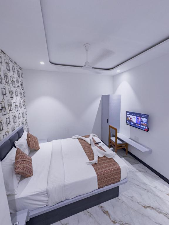 Hotel Flora Inn客房内的一张或多张床位