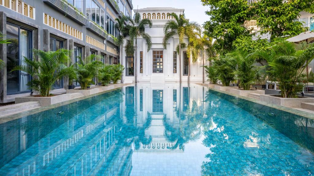 a swimming pool in the middle of a building at Reservoir, Yoga & Wellness Retreat in Siem Reap