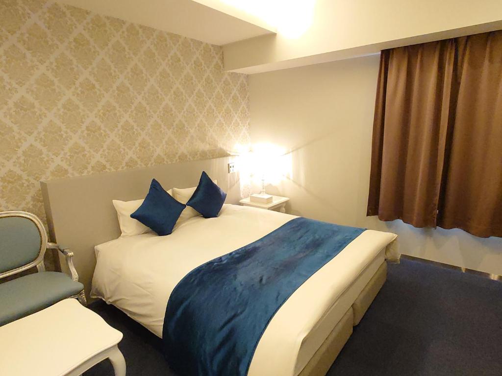 Postel nebo postele na pokoji v ubytování HOTEL LASCALA