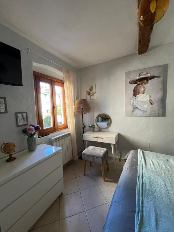 Postel nebo postele na pokoji v ubytování Un piede nel Chianti
