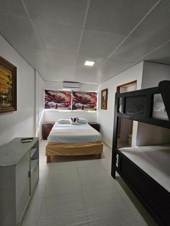 Postel nebo postele na pokoji v ubytování Hostal Shangiovys