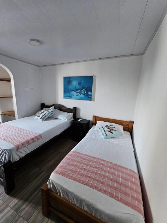 Postel nebo postele na pokoji v ubytování Hostal Shangiovys