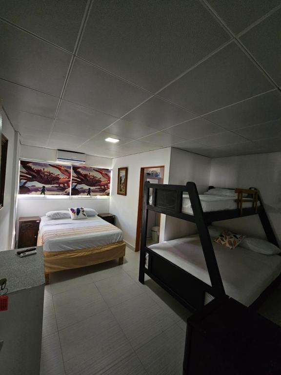 Postel nebo postele na pokoji v ubytování Hostal Shangiovys