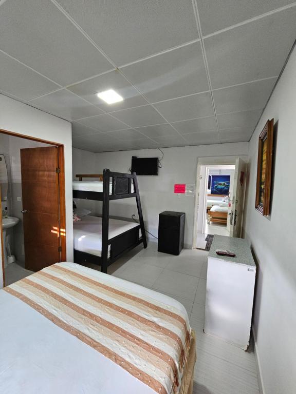 Postel nebo postele na pokoji v ubytování Hostal Shangiovys