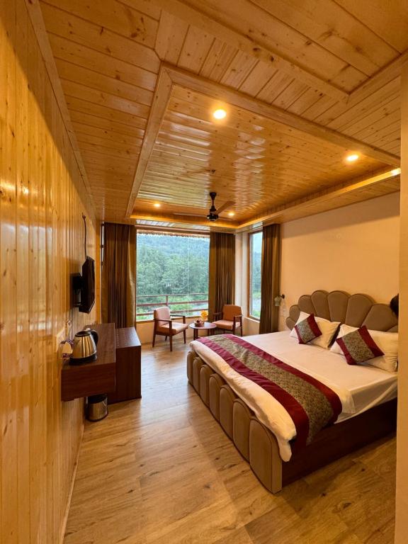 a bedroom with a large bed in a room at Apurwa Grand Resort in Baragrān