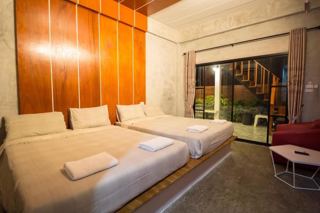 Postel nebo postele na pokoji v ubytování Virawan home villa ที่พักเกาะล้าน