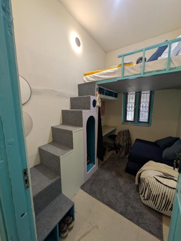 Ein Bett oder Betten in einem Zimmer der Unterkunft Serendipity Hostel & Cats Cafe